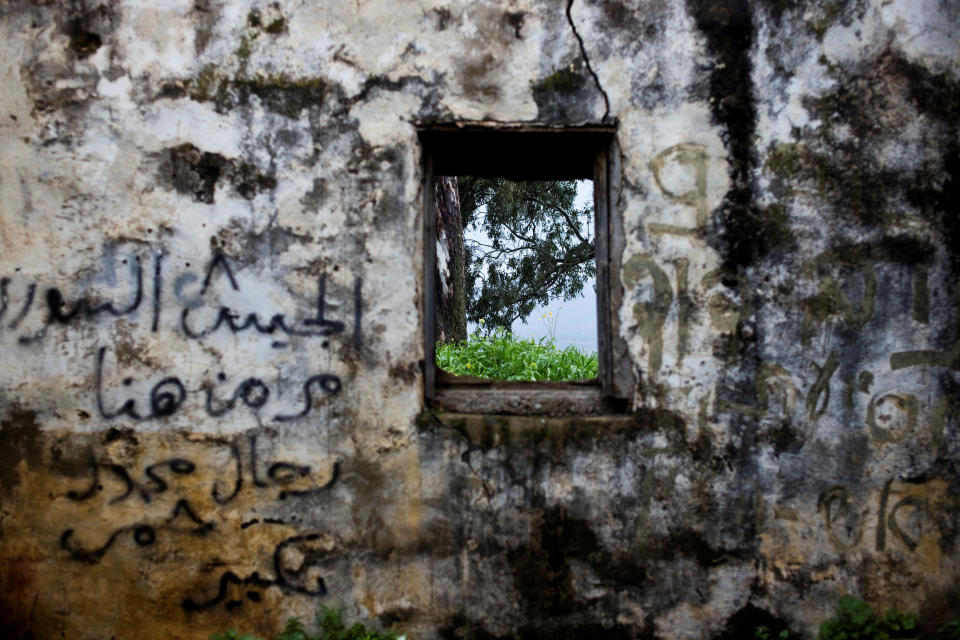 The wall of a structure is seen in a former Syrian outpost in the Israeli-occupied Golan Heights, the territory that Israel captured from Syria in the 1967 Middle East war, February 27, 2019. In stark contrast to the beauty of the surrounding countryside, it is now crumbling and covered in graffiti, one Arabic message reading: "The Syrian army passed by here."  (Photo: Ronen Zvulun/Reuters)