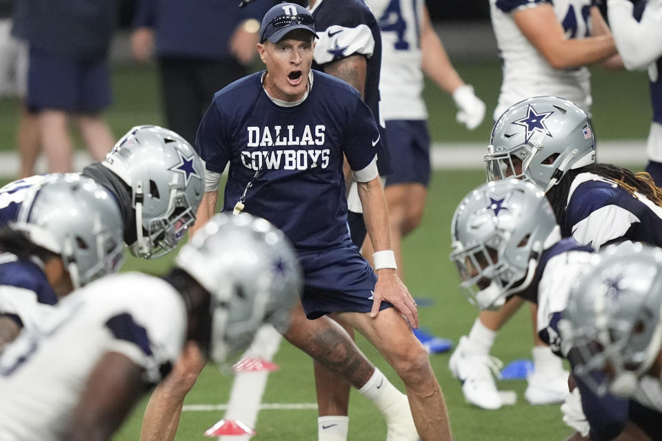 FILE - Dallas Cowboys special teams coordinator John Fassel, center, works with players during an NFL football team practice in Frisco, Texas, Wednesday, May 22, 2024. The NFL is bringing the kickoff back to life, starting with teams investing time in offseason workouts — with plans for plenty more in training camps — into something that had become a pointless exercise. (AP Photo/LM Otero, File)