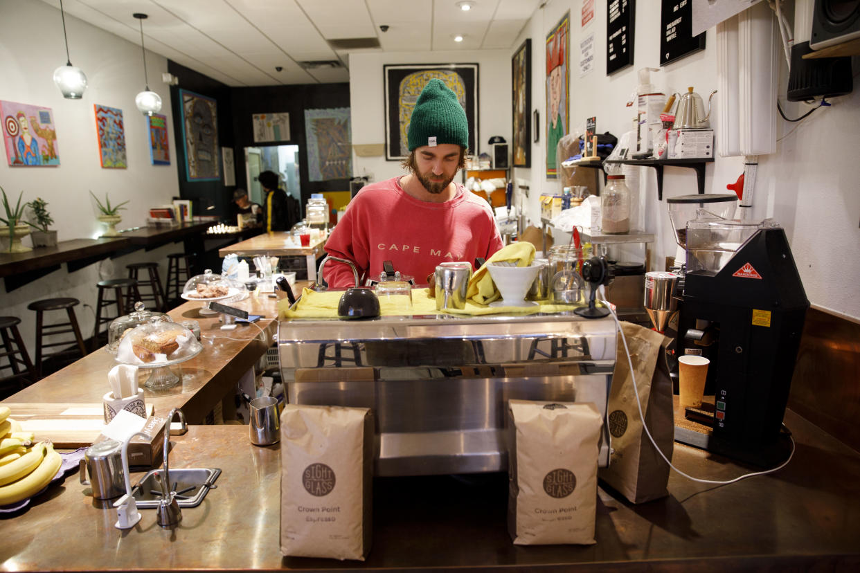 John Schwarz, co-owner of Weird Wave Coffee, prepares a beverage in the Boyle Heights, Los Angeles, shop. (Photo: Patrick T. Fallon for Yahoo News)