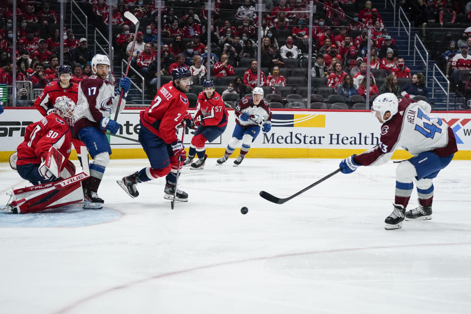 Colorado Avalanche left wing Darren Helm (43) scores a goal past Washington Capitals goaltender Ilya Samsonov (30) during the second period of an NHL hockey game Tuesday, Oct. 19, 2021, in Washington. (AP Photo/Alex Brandon)