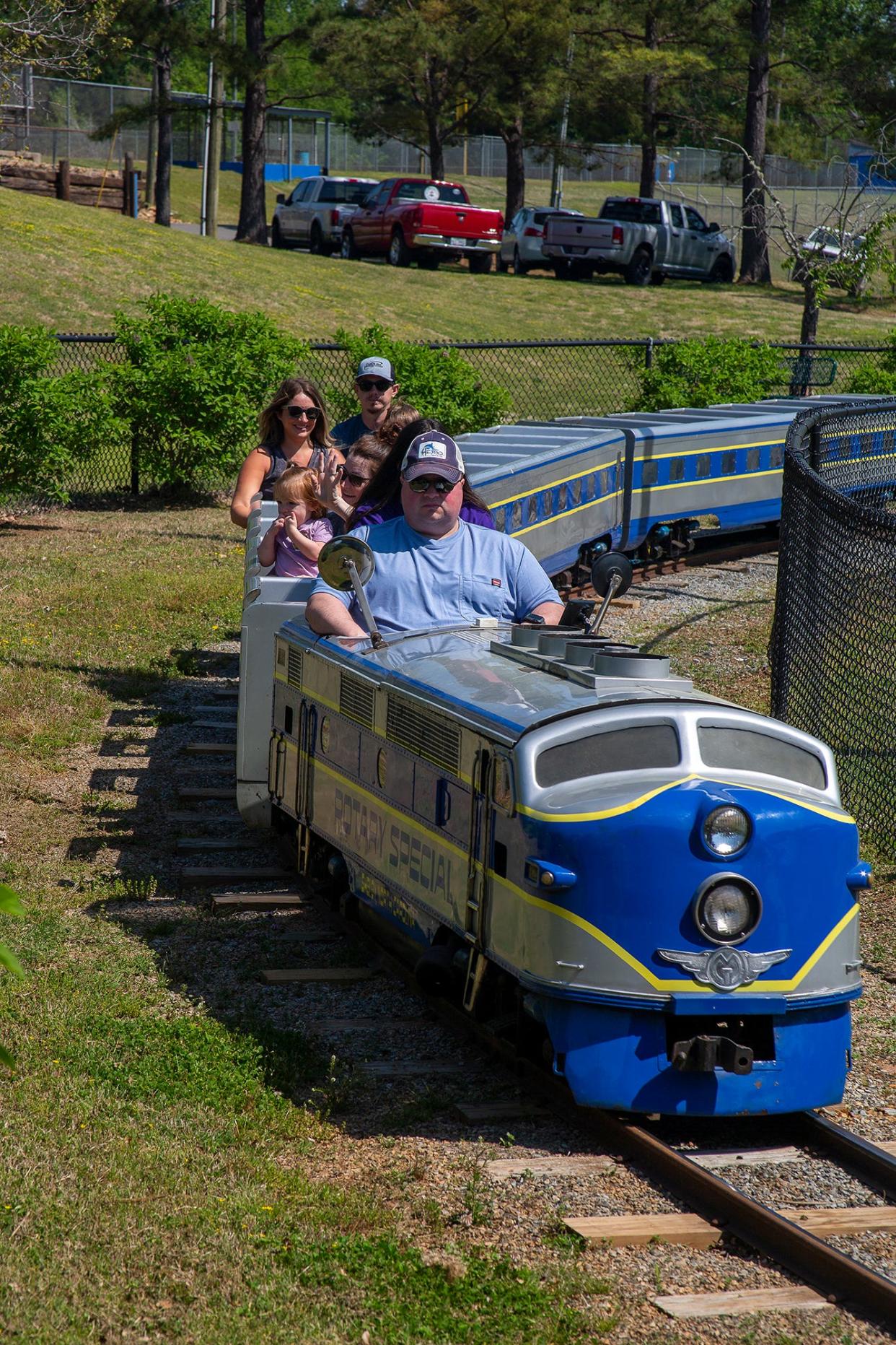 Children of all ages ride the Rotary Special at the Shelby Merry Go Round Festival on Saturday at Shelby City Park.