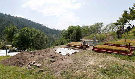 Ambreen Riasat's fresh grave is seen in the graveyard in the village of Makol outside Abbottabad, Pakistan May 6, 2016. REUTERS/Caren Firouz