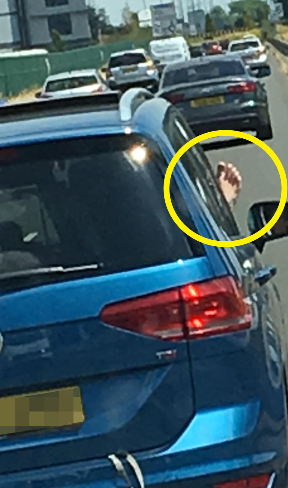 Steven Ellis was on his way from a drop-off in Newport, south east Wales, on Monday afternoon when he spotted the flexible driver apparently driving ‘at 40mph’ catching a tan on her right foot. Photo: Caters