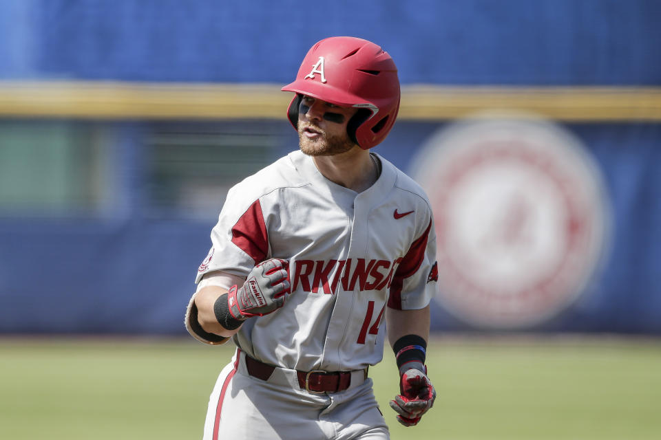 Arkansas' Cullen Smith reacts after hitting a two-run home run against Mississippi in the first inning of an NCAA college baseball game during the Southeastern Conference tournament Saturday, May 29, 2021, in Hoover, Ala. (AP Photo/Butch Dill)