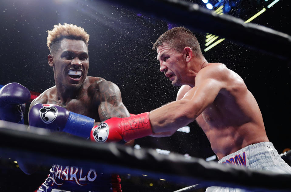 Jermall Charlo, left, punches Russia’s Matt Korobov during the 12th round of a WBC middleweight boxing match Saturday, Dec. 22, 2018, in New York. Charlo won the fight. (AP Photo/Frank Franklin II)