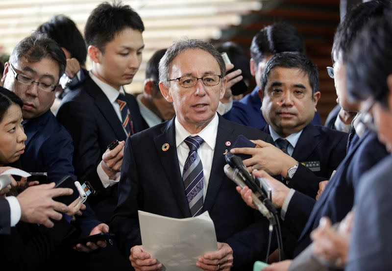 FILE PHOTO: Okinawa Governor Denny Tamaki speaks to media after a meeting with Japanese Prime Minister Shinzo Abe in Tokyo