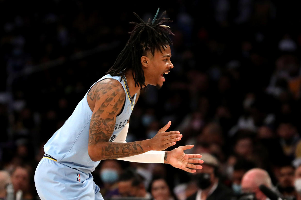 LOS ANGELES, CALIFORNIA - JANUARY 09: Ja Morant #12 of the Memphis Grizzlies reacts to a play during the third quarter against the Los Angeles Lakers at Crypto.com Arena on January 09, 2022 in Los Angeles, California. NOTE TO USER: User expressly acknowledges and agrees that, by downloading and or using this photograph, User is consenting to the terms and conditions of the Getty Images License Agreement. (Photo by Katelyn Mulcahy/Getty Images)