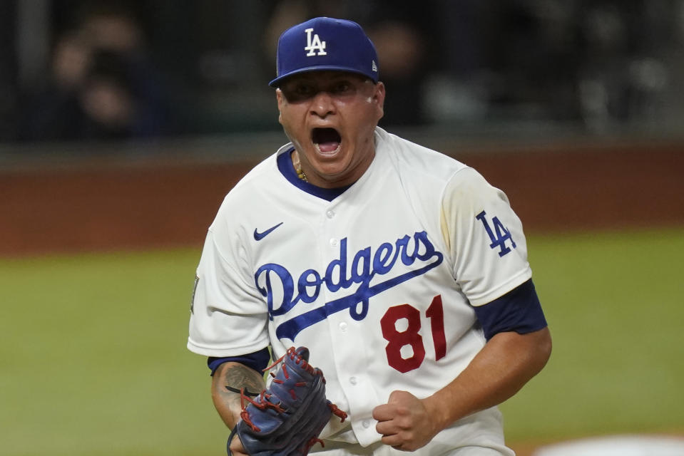 Los Angeles Dodgers pitcher Victor Gonzalez celebrates after striking out the side against the Tampa Bay Rays during the sixth inning in Game 6 of the baseball World Series Tuesday, Oct. 27, 2020, in Arlington, Texas. (AP Photo/Eric Gay)