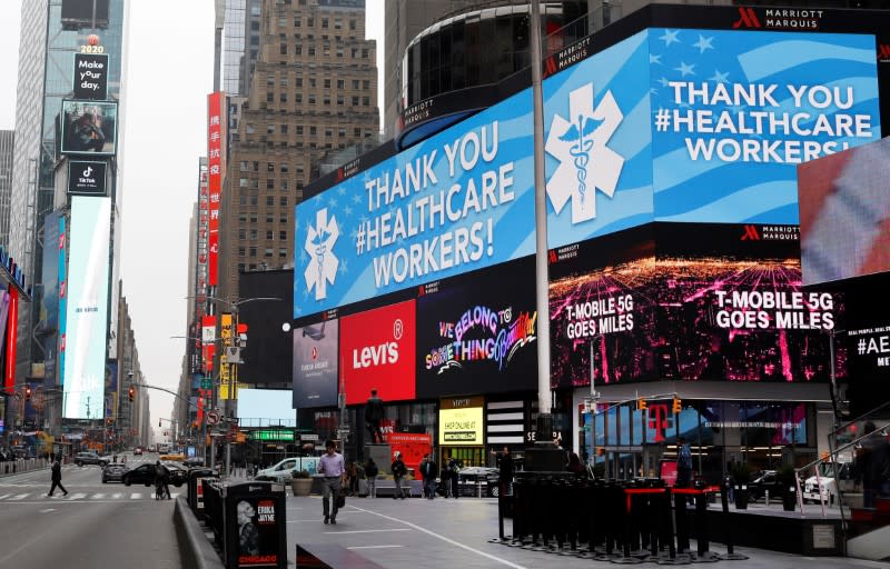A message thanking healthcare workers during the coronavirus outbreak is seen on an electronic billboard in a nearly empty Times Square