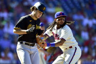 Philadelphia Phillies' Freddy Galvis, right, tags out Pittsburgh Pirates' Max Kranick (45) during the fourth inning of a baseball game, Sunday, Sept. 26, 2021, in Philadelphia. (AP Photo/Derik Hamilton)