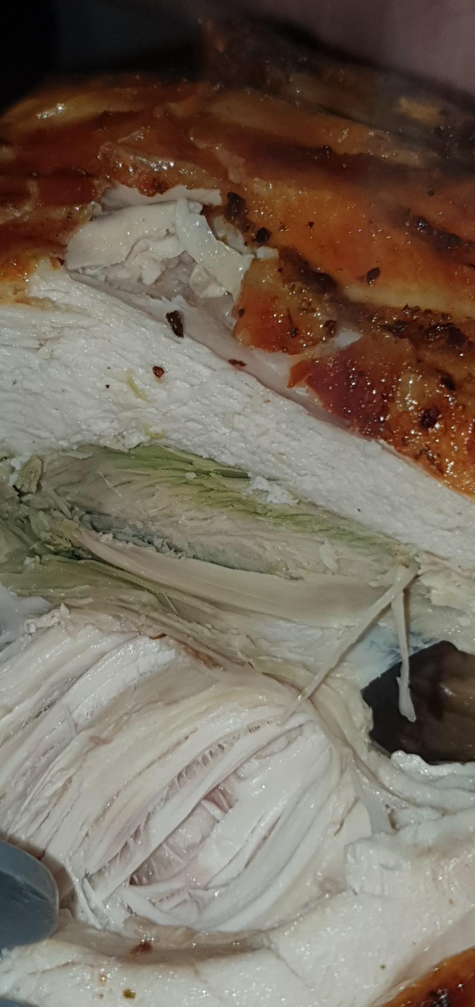 Photo shows green flesh inside a roast Coles chicken.