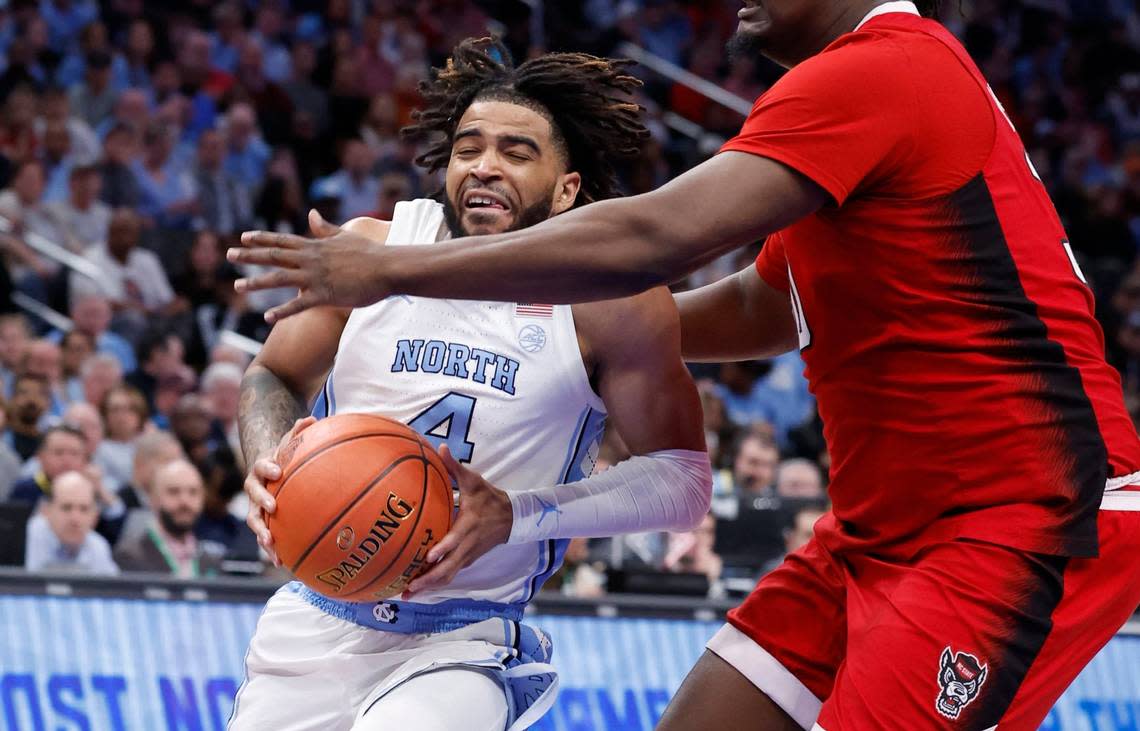 North Carolina’s RJ Davis (4) drives past N.C. State’s DJ Burns Jr. (30) during the first half of N.C. State’s game against UNC in the championship game of the 2024 ACC Men’s Basketball Tournament at Capital One Arena in Washington, D.C., Saturday, March 16, 2024.