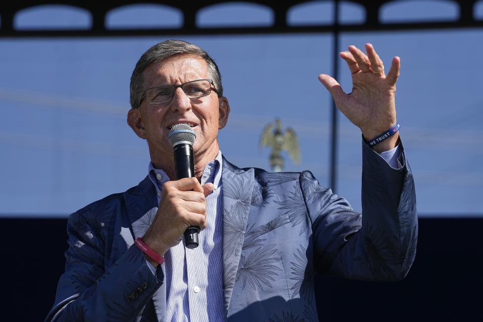 FILE - Former national security adviser Michael Flynn speaks during a "rosary rally" on Sunday, Aug. 6, 2023, in Norwood, Ohio. Former President Donald Trump urged supporters to “guard the vote” during next year's election, a phrase that set off alarm bells among pro-democracy advocates who say it signals permission to his followers to take extreme measures. Flynn, has spent months repeating the phrase. (AP Photo/Darron Cummings, File)