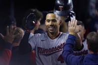 Minnesota Twins' Carlos Correa is greeted in the dugout after his two-run home run during the seventh inning of a baseball game against the Detroit Tigers, Friday, Sept. 30, 2022, in Detroit. (AP Photo/Carlos Osorio)