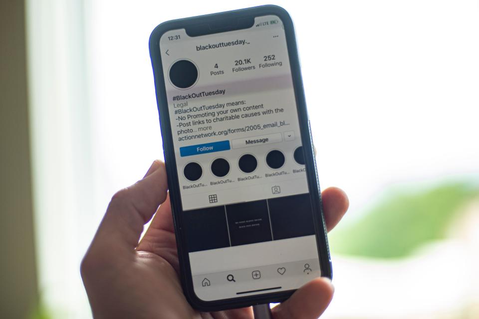 A smartphone displaying the Instagram #blackouttuesday account is seen in Washington on June 2, 2020.(Eric Baradat/AFP via Getty Images)