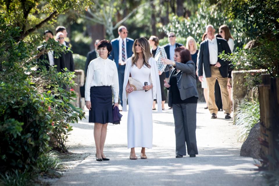 First Lady Melania Trump, center, and Akie Abe, wife of Japanese Prime Minister Shinzo Abe listen as Park Administrator Bonnie White LeMay, right gives a tour of the Morikami Museum and Japanese Gardens in Delray Beach on Saturday, Feb. 11, 2017. (Michael Ares / The Palm Beach Post)