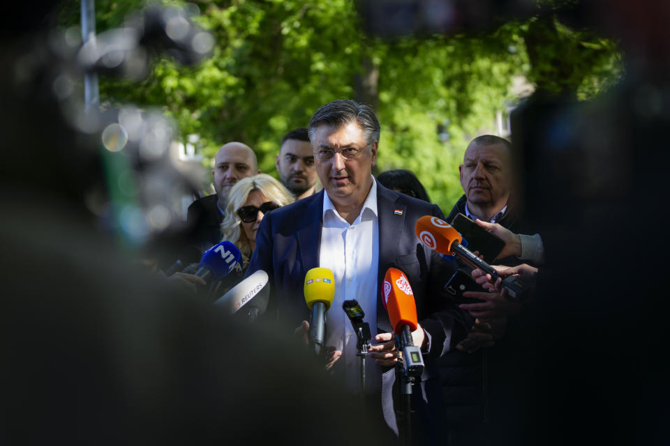 Prime Minister incumbent Andrej Plenkovic speaks to the media after casting his ballot at a polling station in Zagreb, Croatia, Wednesday, April 17, 2024. Croatia is voting in a parliamentary election after a campaign that centered on a bitter rivalry between the president and prime minister of the small European Union and NATO member. (AP Photo/Darko Vojinovic)