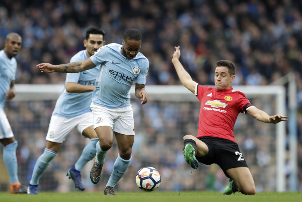 <p>Manchester United’s Ander Herrera slides in as he attempts to tackle Raheem Sterling </p>