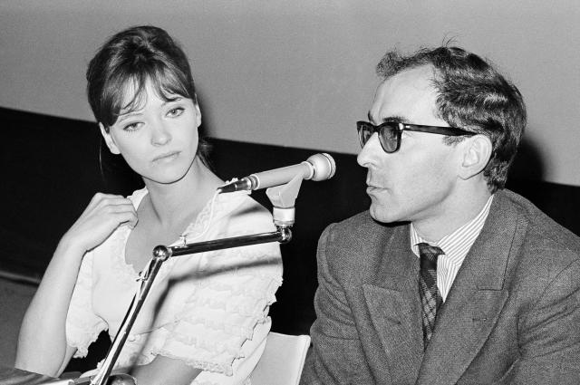 FILE - Movie director Jean Luc Godard and French actress Anna Karina are shown at the International Film Festival in Venice on Aug. 31, 1965. Director Jean-Luc Godard, an icon of French New Wave film who revolutionized popular 1960s cinema, has died, according to French media. He was 91. Born into a wealthy French-Swiss family on Dec. 3, 1930, in Paris, the ingenious "enfant terrible" stood for years as one of the world's most vital and provocative directors in Europe and beyond — beginning in 1960 with his debut feature "Breathless." (AP Photo/Mario Torrisi, File)