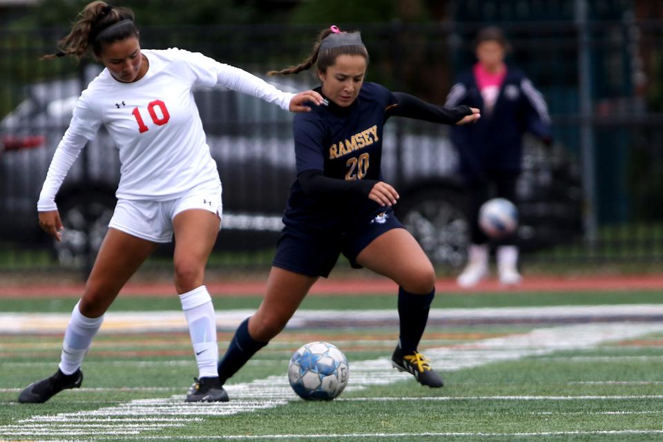 Abby Potto, of Glen Rock, tries to prevent Natalia Kull, of Ramsey, from controlling the ball. Ramsey went on to win, 7-0. Sunday, October 2, 2022