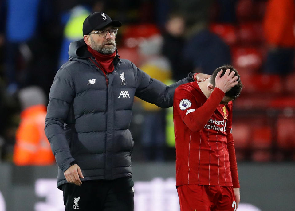 Soccer Football - Premier League - Watford v Liverpool - Vicarage Road, Watford, Britain - February 29, 2020  Liverpool manager Juergen Klopp and Andrew Robertson look dejected at the end of the match   REUTERS/David Klein  EDITORIAL USE ONLY. No use with unauthorized audio, video, data, fixture lists, club/league logos or "live" services. Online in-match use limited to 75 images, no video emulation. No use in betting, games or single club/league/player publications.  Please contact your account representative for further details.