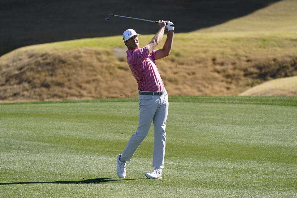 Hudson Swafford hits from the third fairway during the final round of the American Express golf tournament on the Pete Dye Stadium Course at PGA West, Sunday, Jan. 23, 2022, in La Quinta, Calif. (AP Photo/Marcio Jose Sanchez)