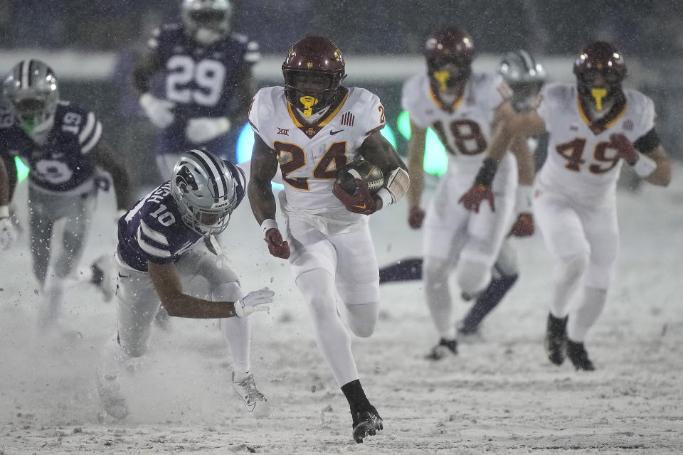 Kansas State cornerback Jacob Parrish (10) chases Iowa State running back Abu Sama III (24) as he runs for a touchdown during the first half of an NCAA college football game Saturday, Nov. 25, 2023, in Manhattan, Kan. (AP Photo/Charlie Riedel)