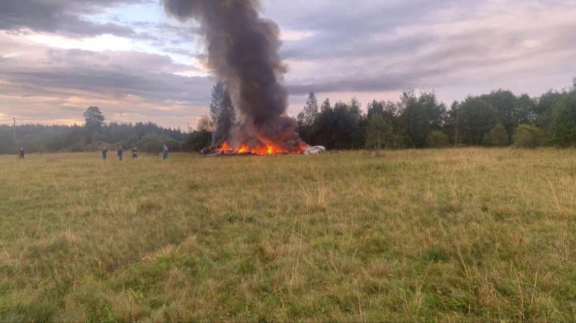 A private jet allegedly carrying Yevgeny Prigozhin and other passengers burns in a field after it crashed.