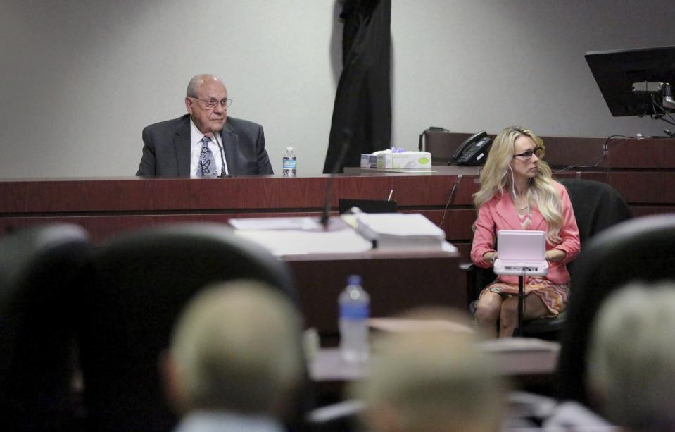 Former Tampa police captain Curtis Reeves, left, takes the stand while giving testimony in his defense during his second-degree murder trial on Thursday, Feb 24, 2022, at the Robert D. Sumner Judicial Center in Dade City, Fla. Reeves is accused of shooting and killing Chad Oulson at a Wesley Chapel movie theater in January 2014. (Douglas R. Clifford/Tampa Bay Times via AP, Pool)