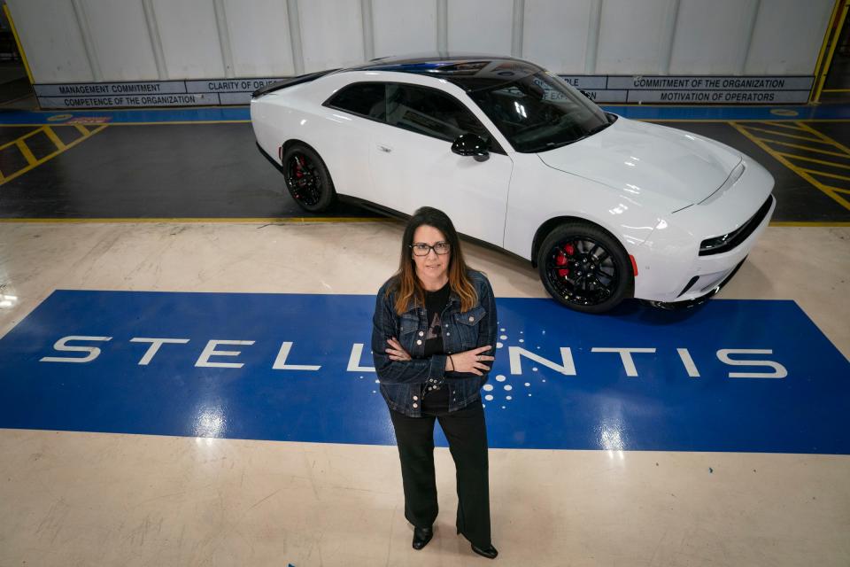 Audrey Moore, the chief engineer of DodgeÕs first electric muscle car, the 2024 Dodge Charger EV, poses with the car on Friday, April 19, 2024 at the Stellantis Windsor Assembly Plant in Windsor, Ontario.