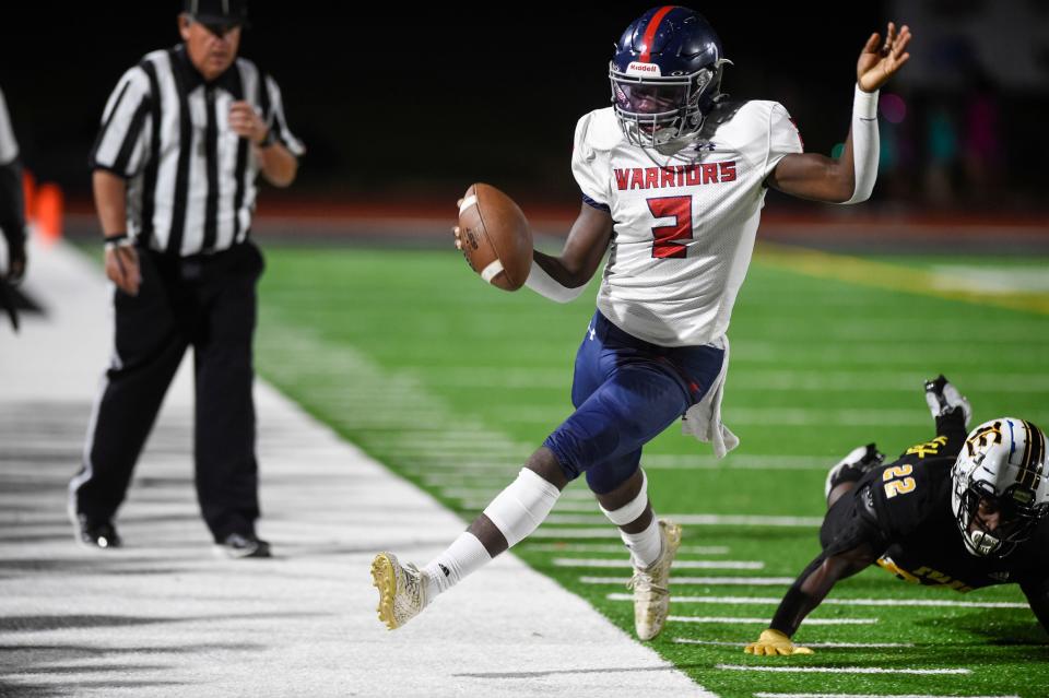 Grovetown quarterback Amare Clark (2) runs the ball at the Evans and Grovetown football game at Evans High School on Friday, Sept. 23, 2022. Evans defeated Grovetown 42-15. 