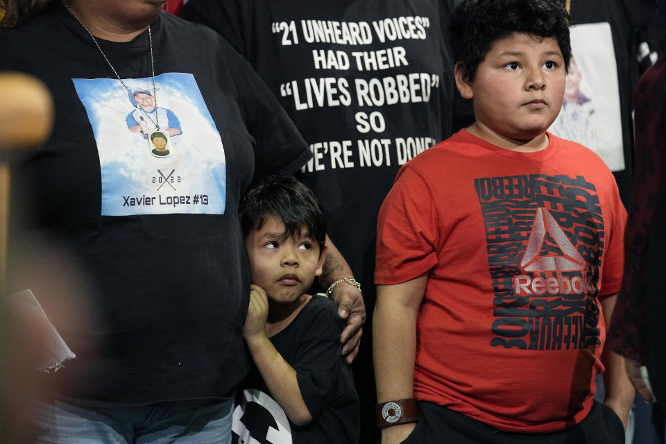 FILE - Family of those killed by a gunman at Robb Elementary School in Uvalde, Texas, stand with Texas State Sen. Roland Gutierrez during a news conference at the Texas Capitol in Austin, Texas, Tuesday, Jan. 24, 2023. Gutierrez says he is filing legislation in the wake of Texas' rising gun violence. (AP Photo/Eric Gay, File)