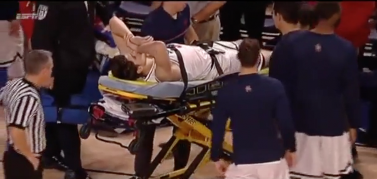 Golden was wheeled off the court on a stretcher, but was alert and responsive. (WatchESPN)