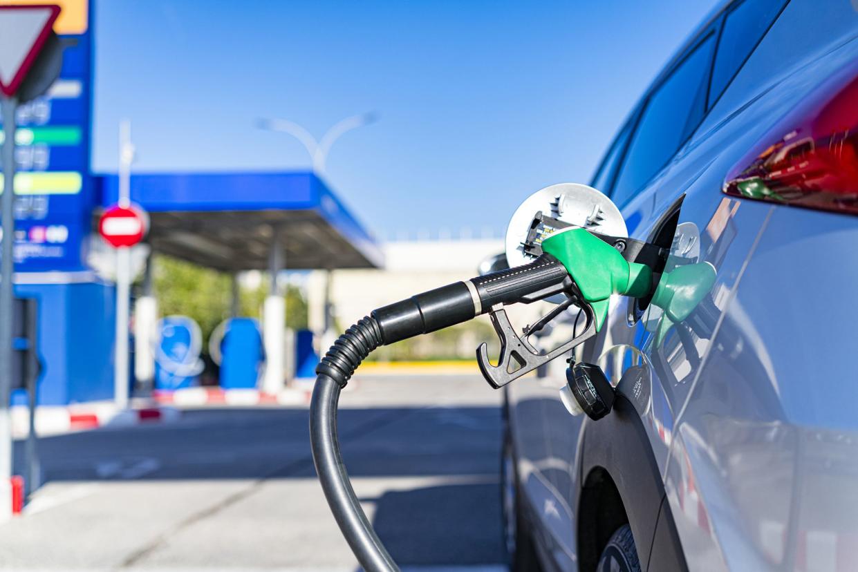 Valencia, Spain. 06 February, 2020. Handle fuel nozzle refueling vehicle at self service gas station. Predominant color is blue. High resolution 42Mp studio digital capture taken with SONY A7rII and Zeiss Batis 40mm F2.0 CF lens