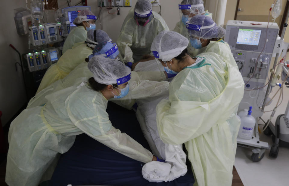 Medical personnel treat a COVID-19 patient at DHR Health, Wednesday, July 29, 2020, in McAllen, Texas. (AP Photo/Eric Gay)