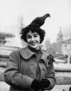 <p>The British-born actress goofs around while feeding pigeons in Trafalgar Square in London. </p>