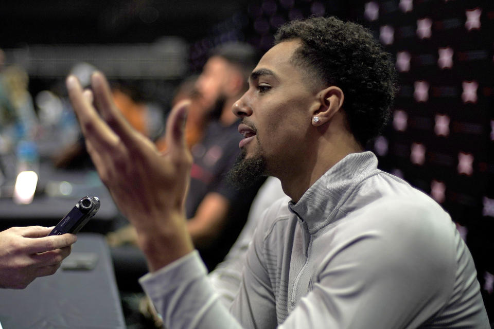 West Virginia forward Emmitt Matthews Jr. speaks to the media during Big 12 NCAA college basketball media day Wednesday, Oct. 19, 2022, in Kansas City, Mo. (AP Photo/Charlie Riedel)