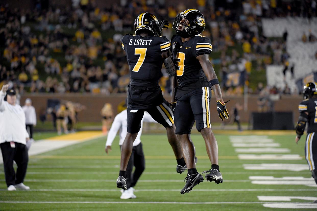 Missouri wide receiver Luther Burden III, right, is congratulated by teammate Dominic Lovett (7) after scoring during the first half of an NCAA college football game against Louisiana Tech Thursday, Sept. 1, in Columbia, Mo.