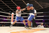 <p>Mike Cintron (red) of the 23rd Precinct in Manhattan knocks back Edgar Duncan of the 42nd Precinct in the Bronx (blue) in the Manhattan North vs. Bronx bout during the NYPD Boxing Championships at Madison Square Garden’s Hulu Theater on March 15, 2018. (Gordon Donovan/Yahoo News) </p>