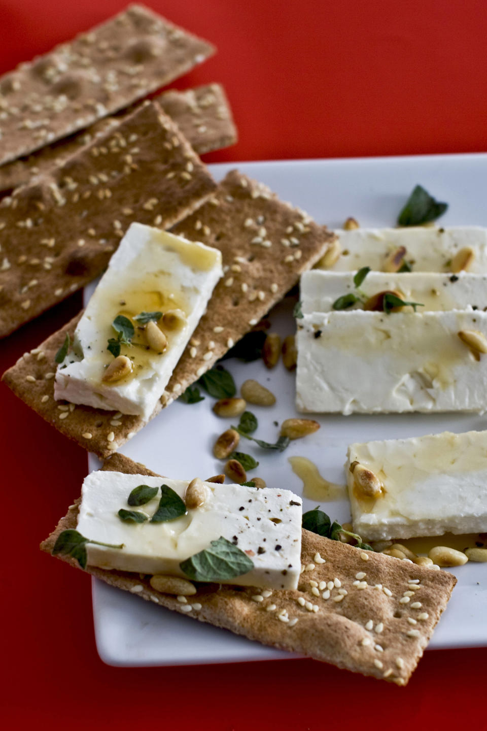 In this undated image, feta cheese and honey are shown served on a platter in Concord, N.H. (AP Photo/Matthew Mead)