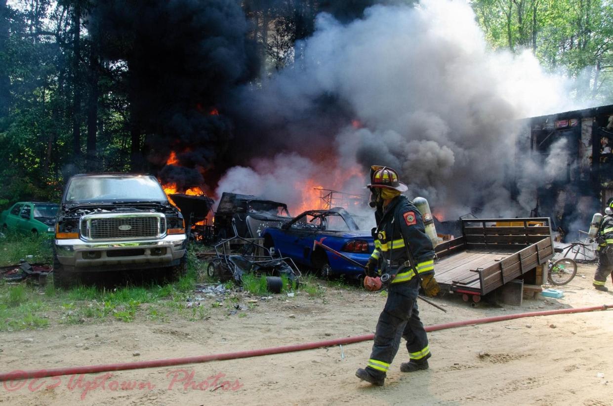 Firefighters from nine local departments extinguished a two-alarm fire in a commercial garage in Hubbardston Friday, officials said.