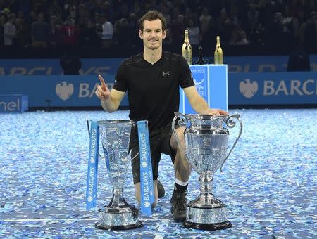 Tennis Britain - Barclays ATP World Tour Finals - O2 Arena, London - 20/11/16 Great Britain's Andy Murray celebrates winning the final against Serbia's Novak Djokovic with the ATP World Tour Finals trophy and Year-End No. 1 Trophy Reuters / Toby Melville Livepic