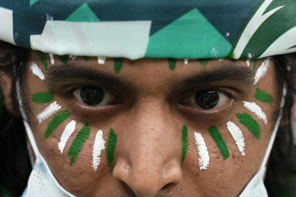 A fan waits for the start of the World Cup group C soccer match between Saudi Arabia and Mexico, at the Lusail Stadium in Lusail, Qatar, Wednesday, Nov. 30, 2022. (AP Photo/Manu Fernandez)