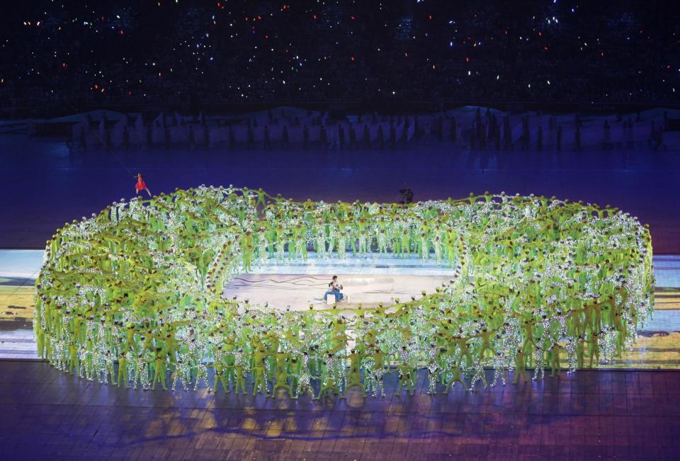 <p>China took us through both its ancient and modern history in 2008, with performers forming the shape of the iconic Bird's Nest stadium which hosted the Opening Ceremony. (AP) </p>