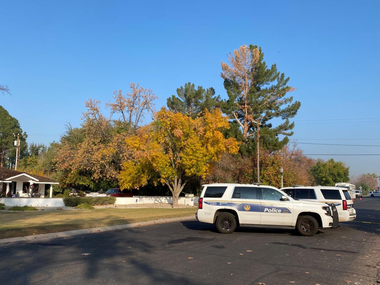 Phoenix police tape blocks off the crime scene early Monday where former Maricopa County Attorney Allister Adel's widower allegedly killed two women and himself during a holiday gathering on Sunday, Dec. 24, 2023.