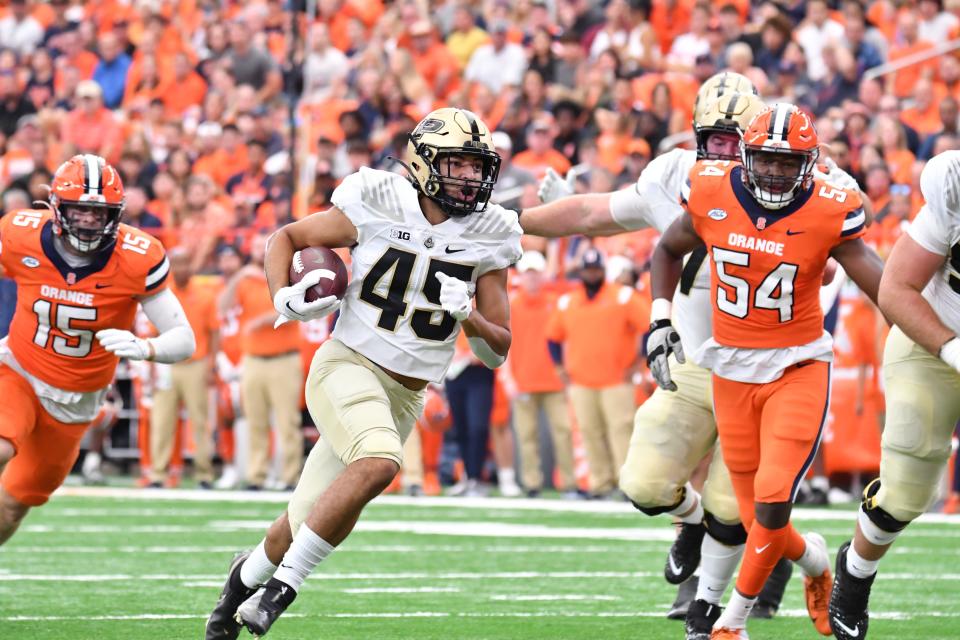 Sep 17, 2022; Syracuse, New York, USA; Purdue Boilermakers running back Devin Mockobee (45) runs for a touchdown against the Syracuse Orange in the first quarter at JMA Wireless Dome.