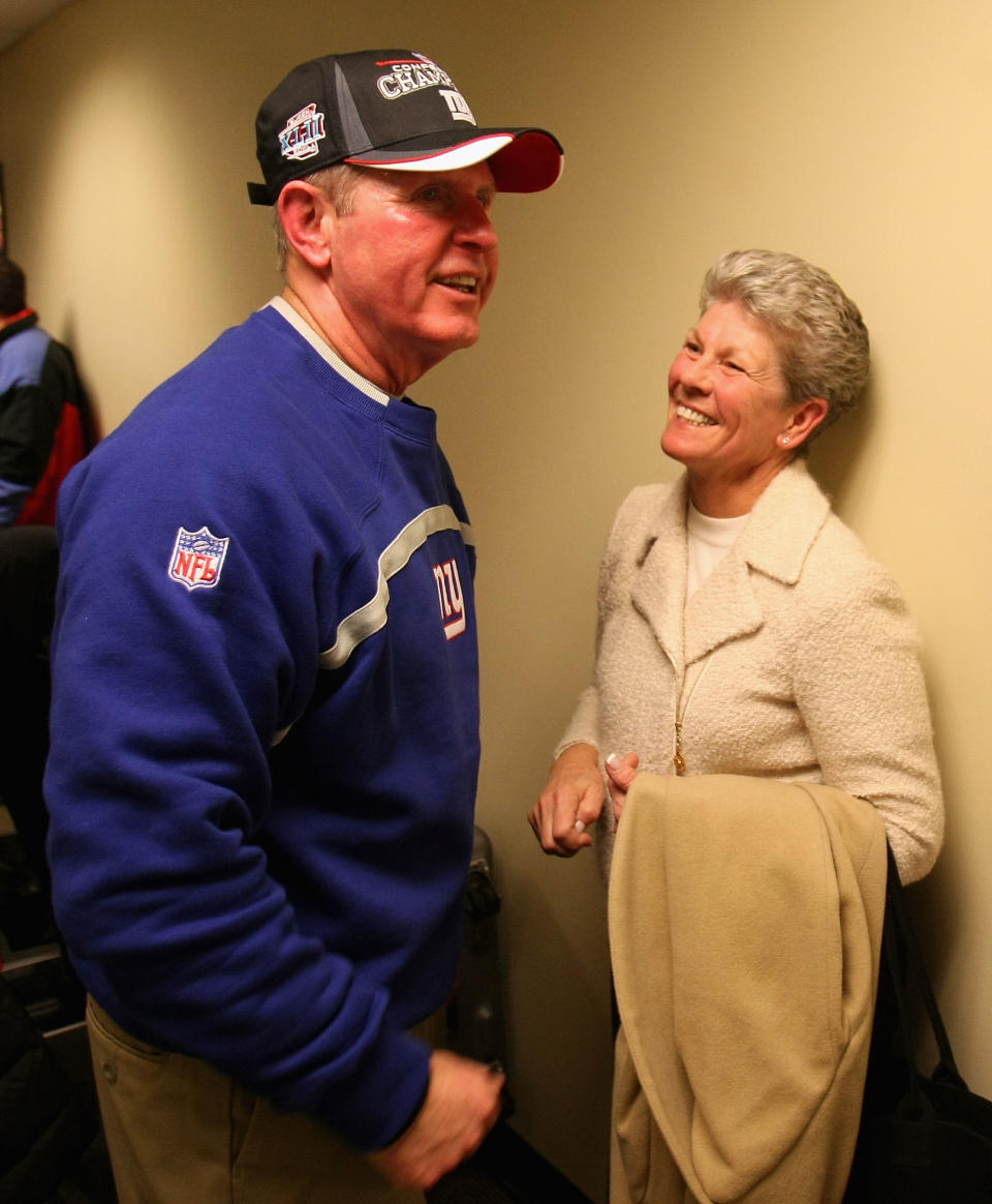 GREEN BAY, WI - JANUARY 20:  Head coach Tom Coughlin of the New York Giants celebrates with his wife Judy Coughlin after winning the NFC championship game against the Green Bay Packers on January 20, 2008 at Lambeau Field in Green Bay, Wisconsin. The Giants defeated the Packers 23-20 in overtime to advance to the Superbowl XLII.  (Photo by Jonathan Daniel/Getty Images)