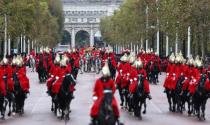 Britain's Queen Elizabeth is driven by carriage as she returns to Buckingham Palace after delivering the State Opening of Parliament in London