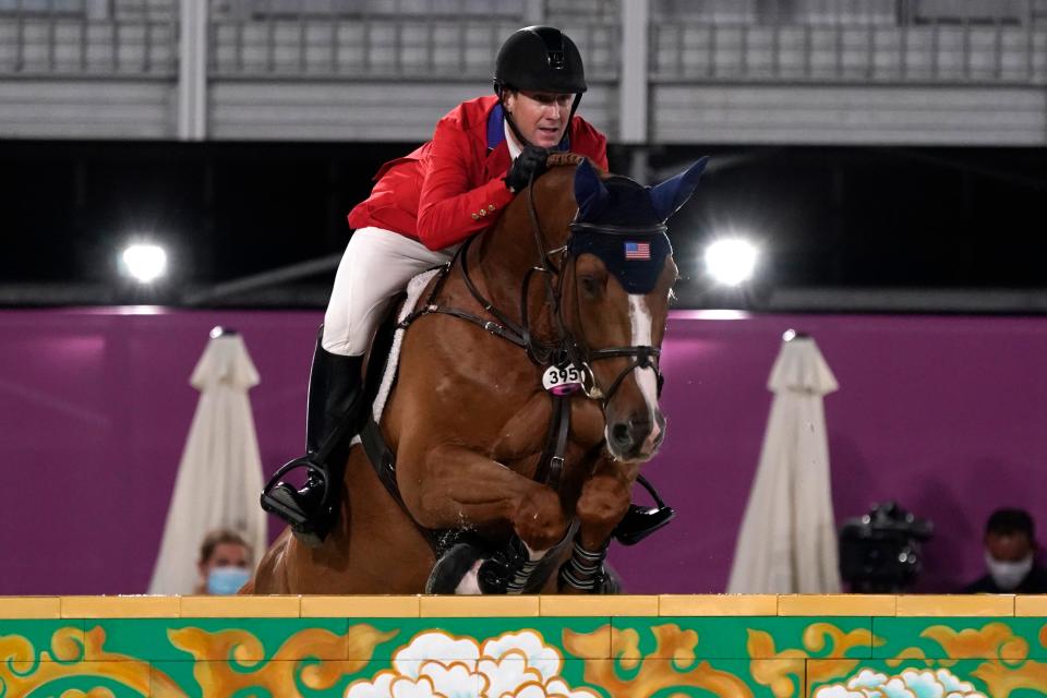 United States' McLain Ward, riding Contagious, competes during the equestrian jumping team final at Equestrian Park in Tokyo at the 2020 Summer Olympics, Saturday, Aug. 7, 2021, in Tokyo, Japan. (AP Photo/Carolyn Kaster)