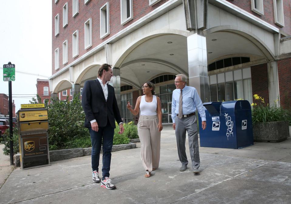 The Portsmouth City Council recently voted to explore a new strategy to acquire the McIntyre site in downtown Portsmouth. Seen on the site are Mayor Deaglan McEachern, left, Assistant Mayor Joanna Kelley and City Councilor John Tabor.